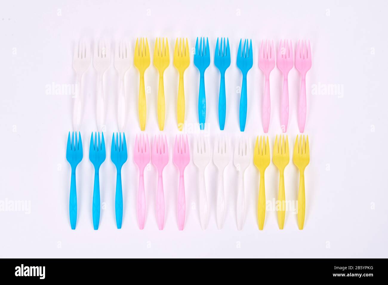 Disposable plastic forks on white background Stock Photo