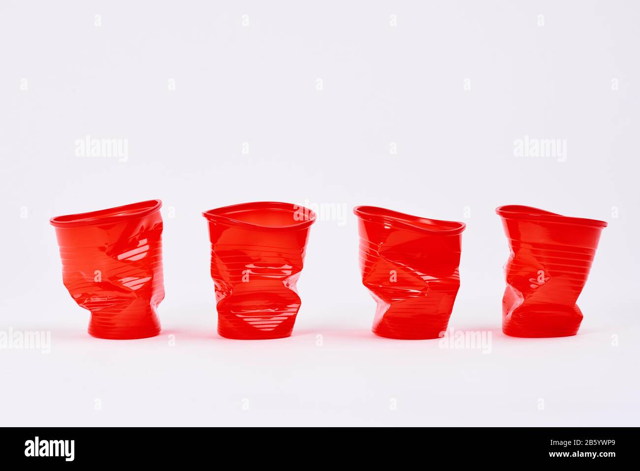 https://c8.alamy.com/comp/2B5YWP9/four-disposable-plastic-cups-on-white-background-2B5YWP9.jpg