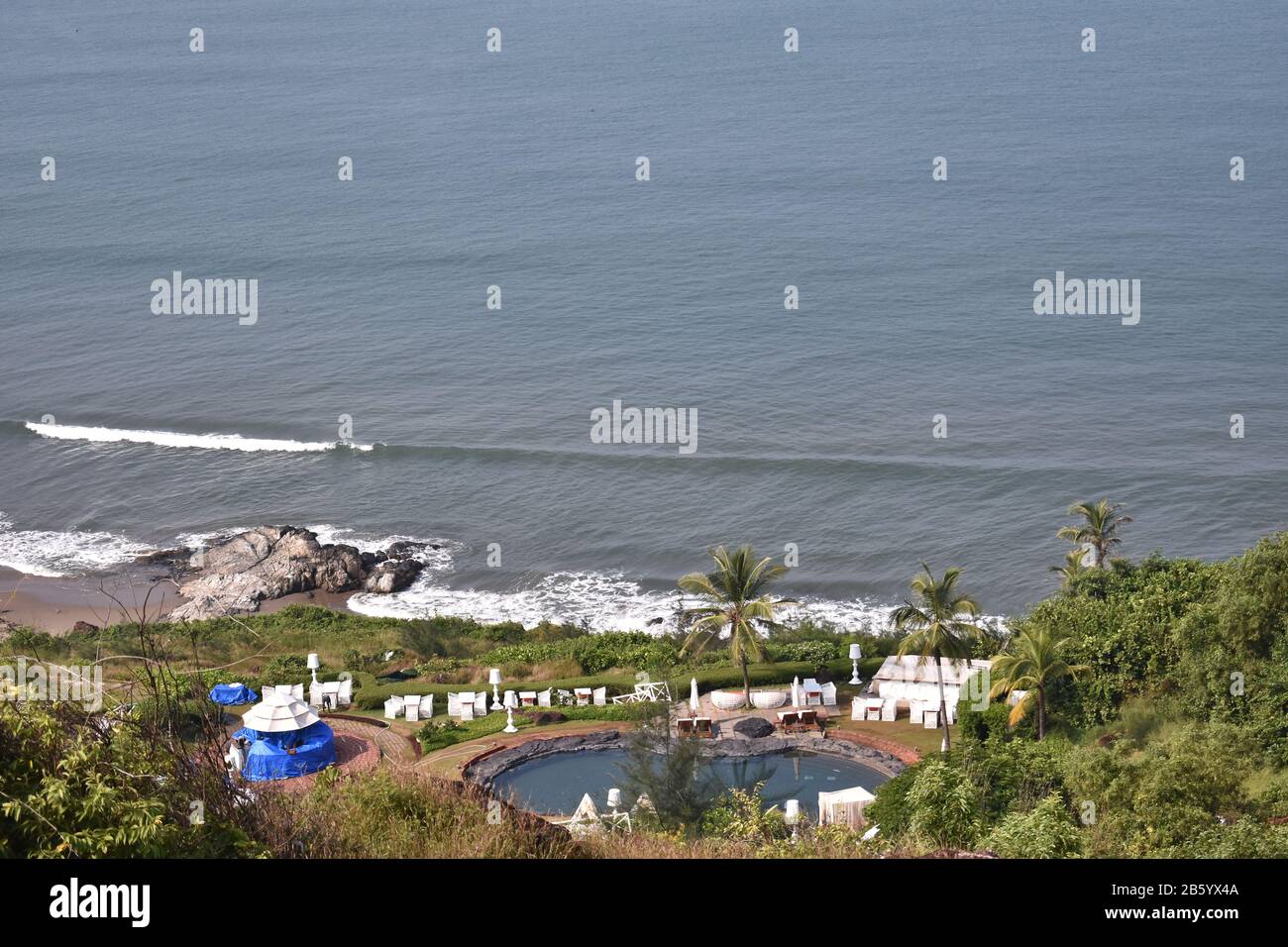 ariel shot of a villa with swimming pool near the beach in goa Stock Photo