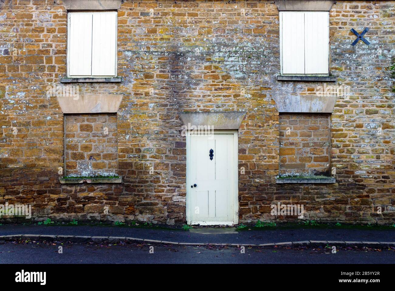 old door stone wall building texture in england uk Stock Photo - Alamy