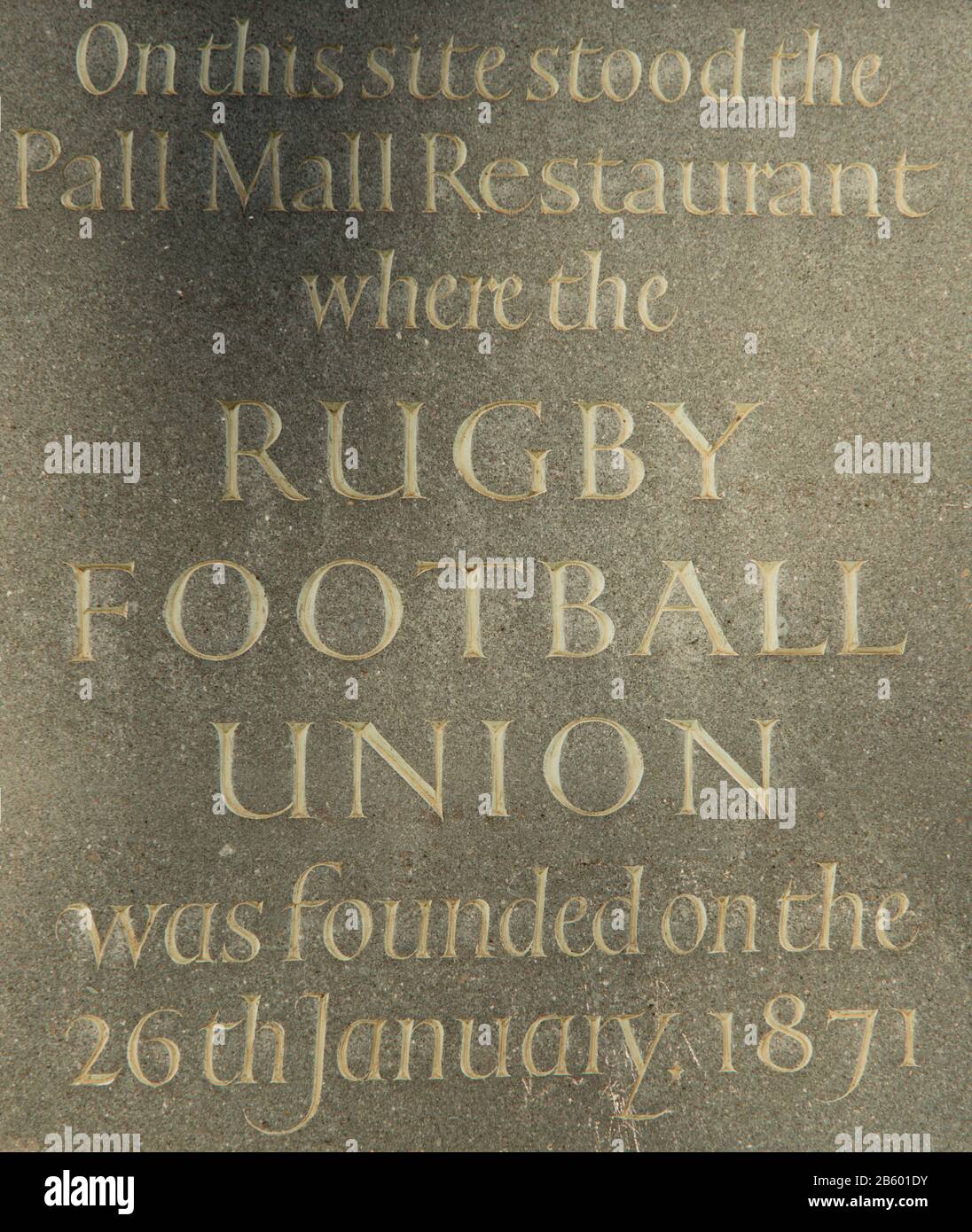 Stone plaque, memorial to the Pall Mall restaurant where the Rugby Football Union was founded on 26 January 1871, in Cockspur St, London SW1 Stock Photo