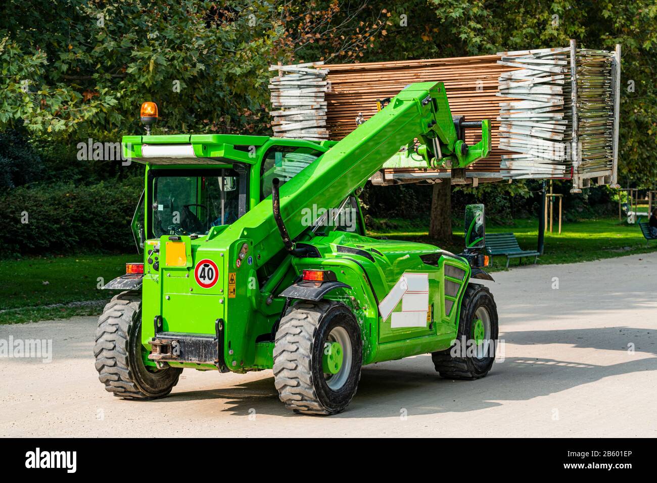 Telescopic handler, forklift truck with cargo on the road Stock Photo