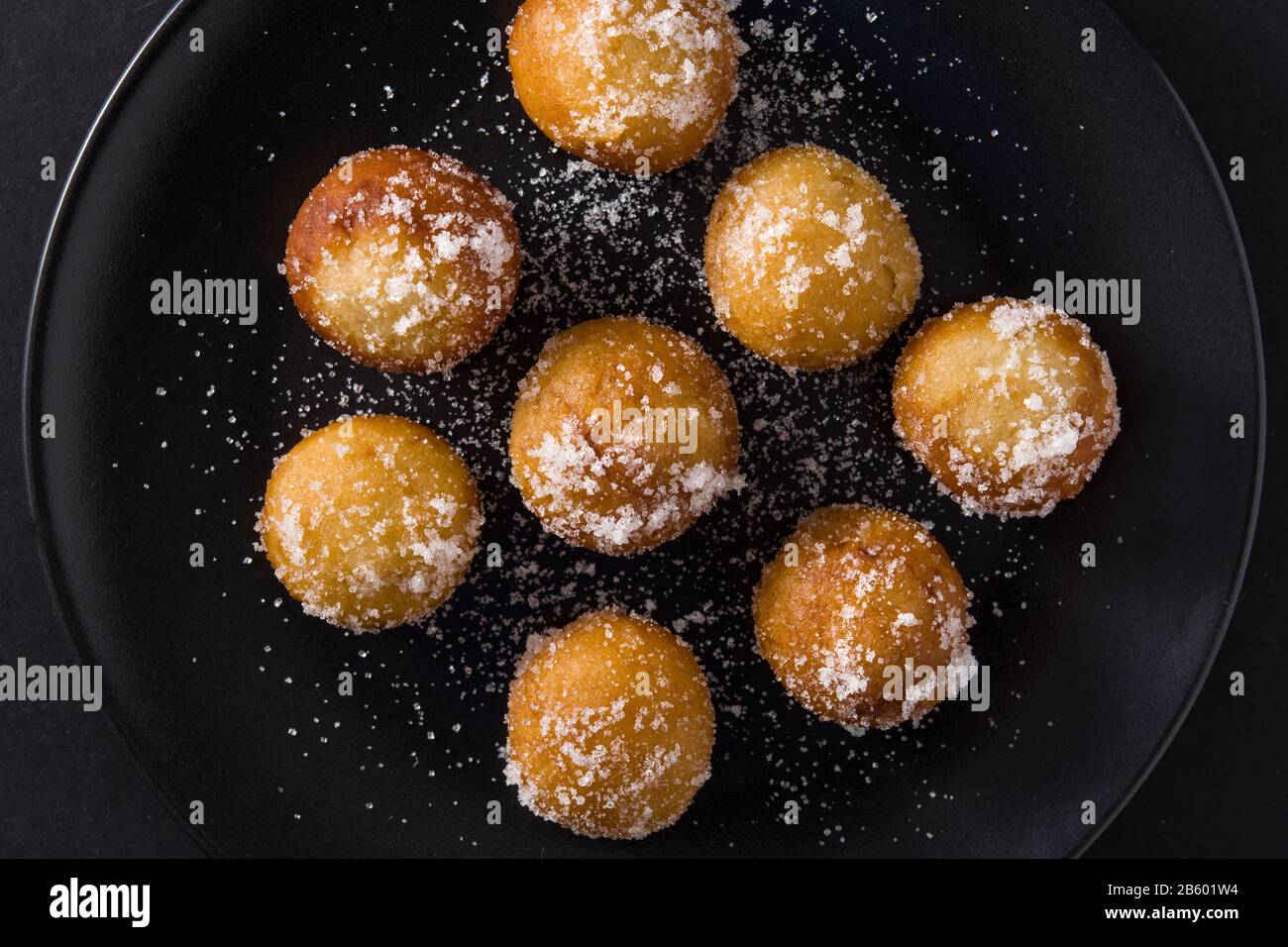 Carnival fritters or buñuelos de viento for holy week on black background Stock Photo