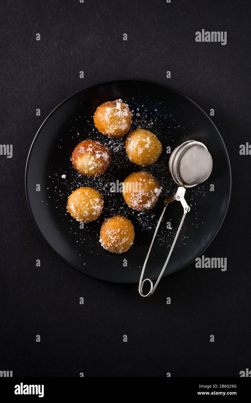 Carnival fritters or buñuelos de viento for holy week on black background Stock Photo