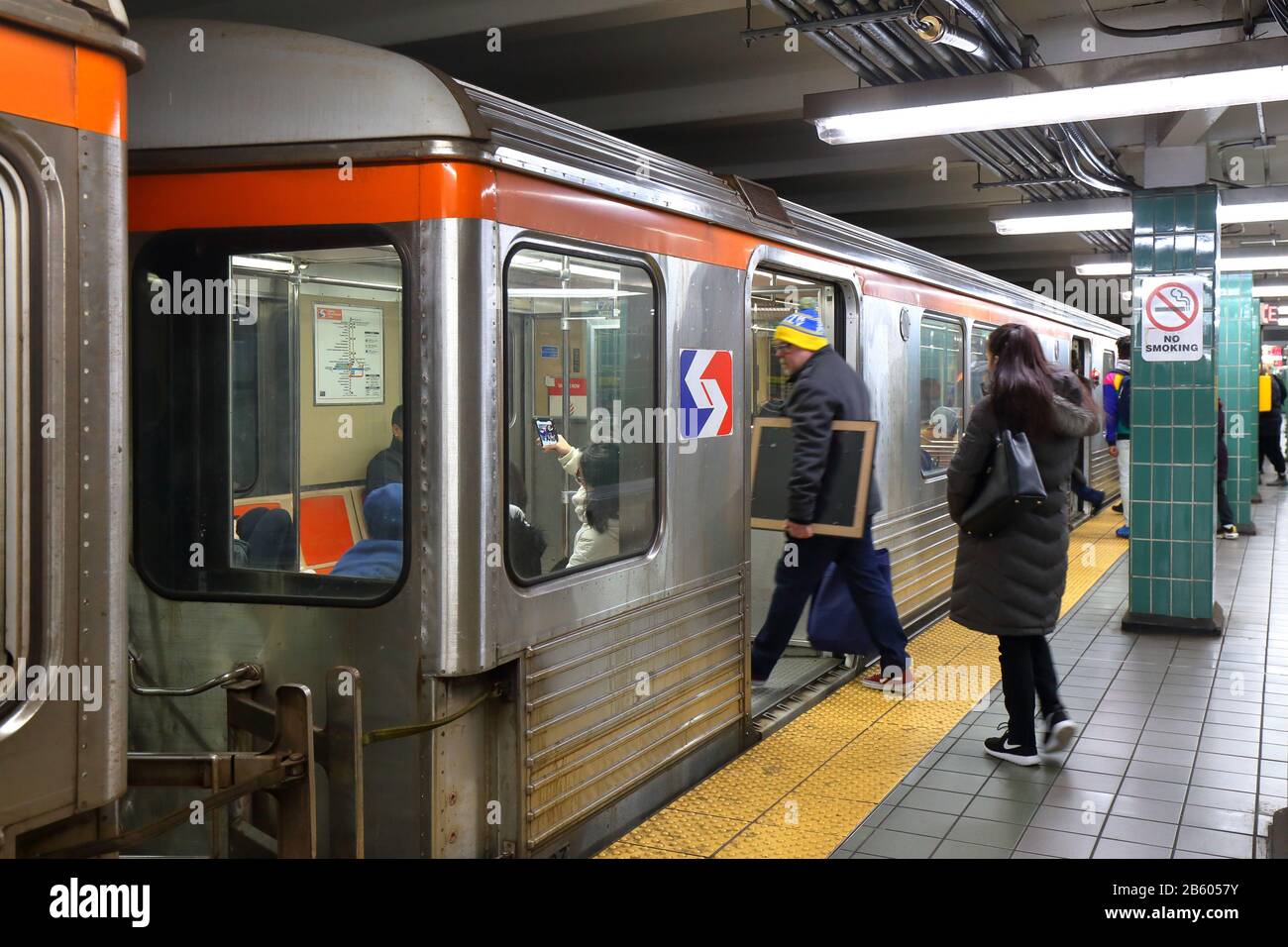 People boarding a SEPTA Broad Street Line subway train at Tasker Morris in South Philly, Philadelphia, PA. February 29, 2020. Stock Photo