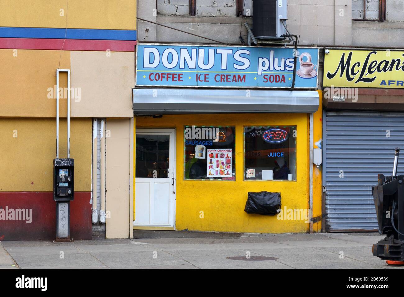 Donut Plus, 1400 West Erie Avenue, Philadelphia, PA. exterior storefront of a donut and coffee shop in Nicetown. Stock Photo