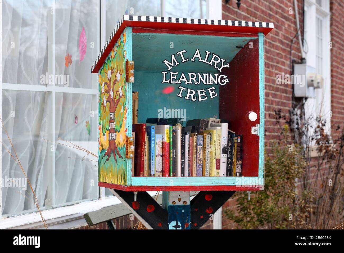 A branch of a Free Little Library outside Mt. Airy Learning Tree in Mt. Airy, Philadelphia, PA. Stock Photo