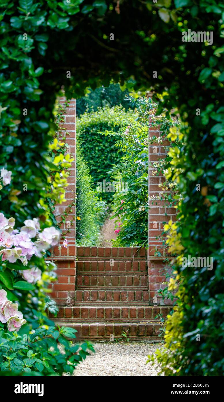 steps leading through doorway into garden Stock Photo