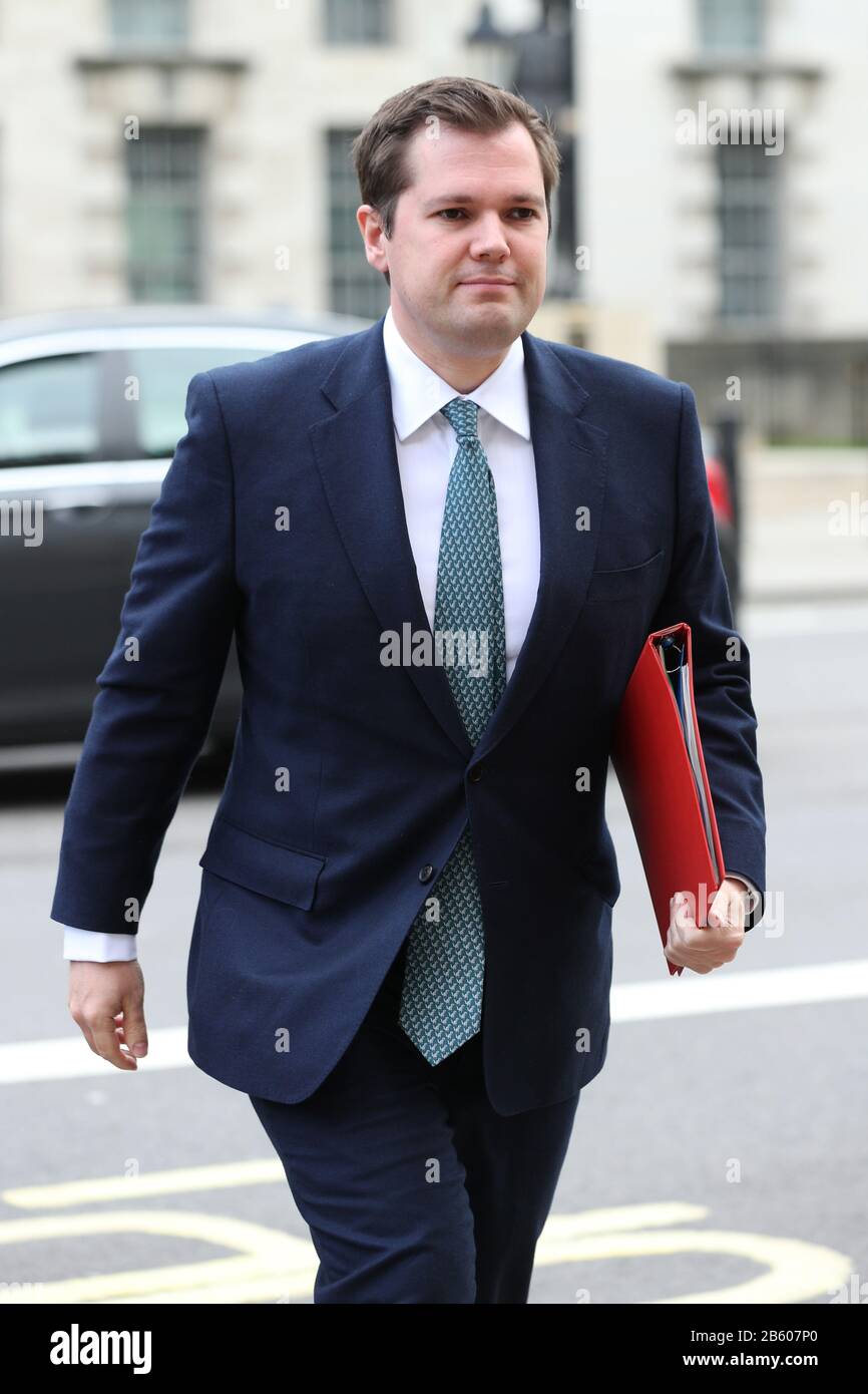 Housing, Communities and Local Government Secretary, Robert Jenrick arrives at the Cabinet Office, Whitehall, London, for a meeting of the Government's emergency committee Cobra to discuss coronavirus. Stock Photo