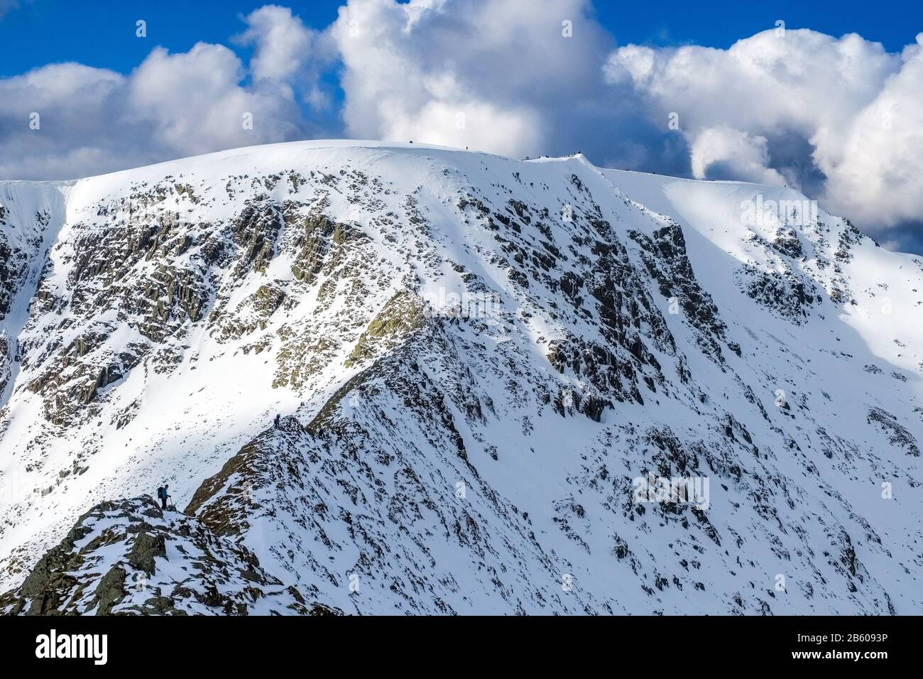 Striding Edge on Helvellyn in winter. The ridge is a popular summer scramble and winter mountaineering challenge. Lake District , Stock Photo