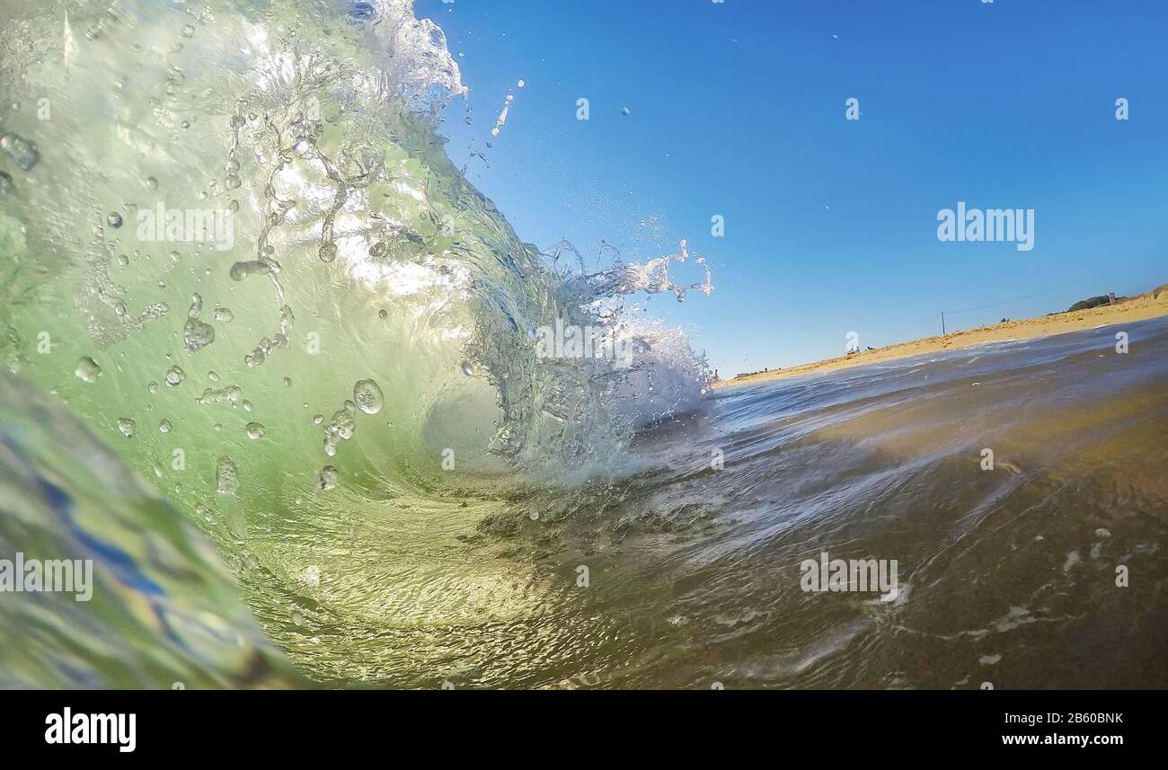 Empty beach splashing waves in hi-res stock photography and images - Alamy