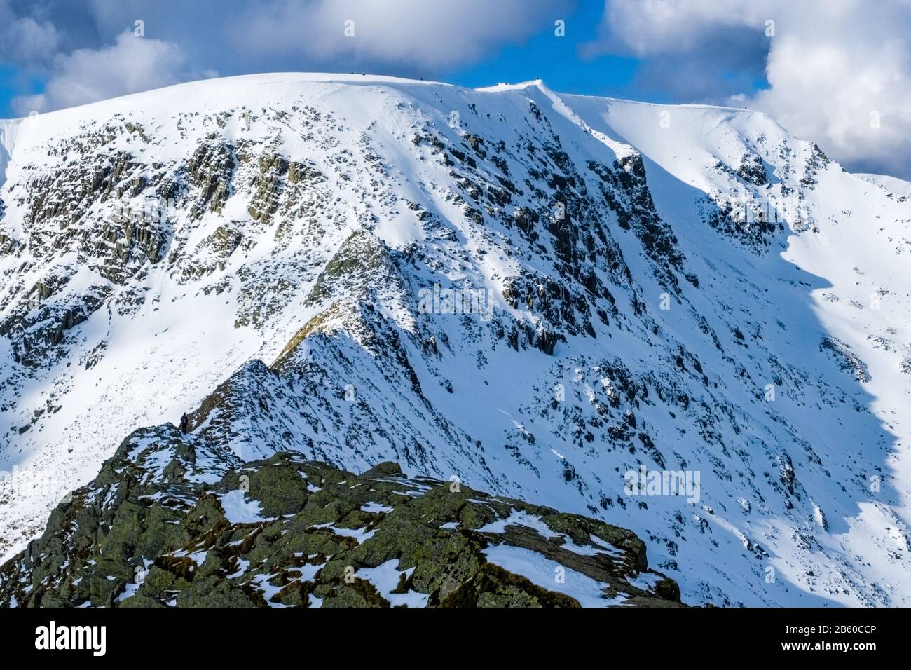Heeling Ridge Striding Edge on Helvellyn in winter. The ridge is a popular summer ...