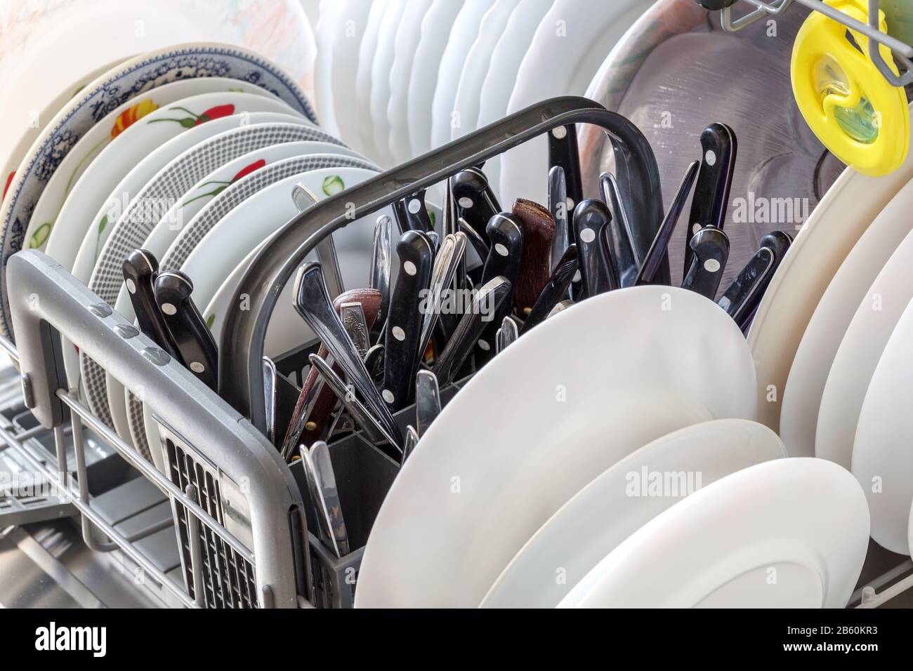 Clean dishes after washing in the dishwasher. Close up Stock Photo Alamy