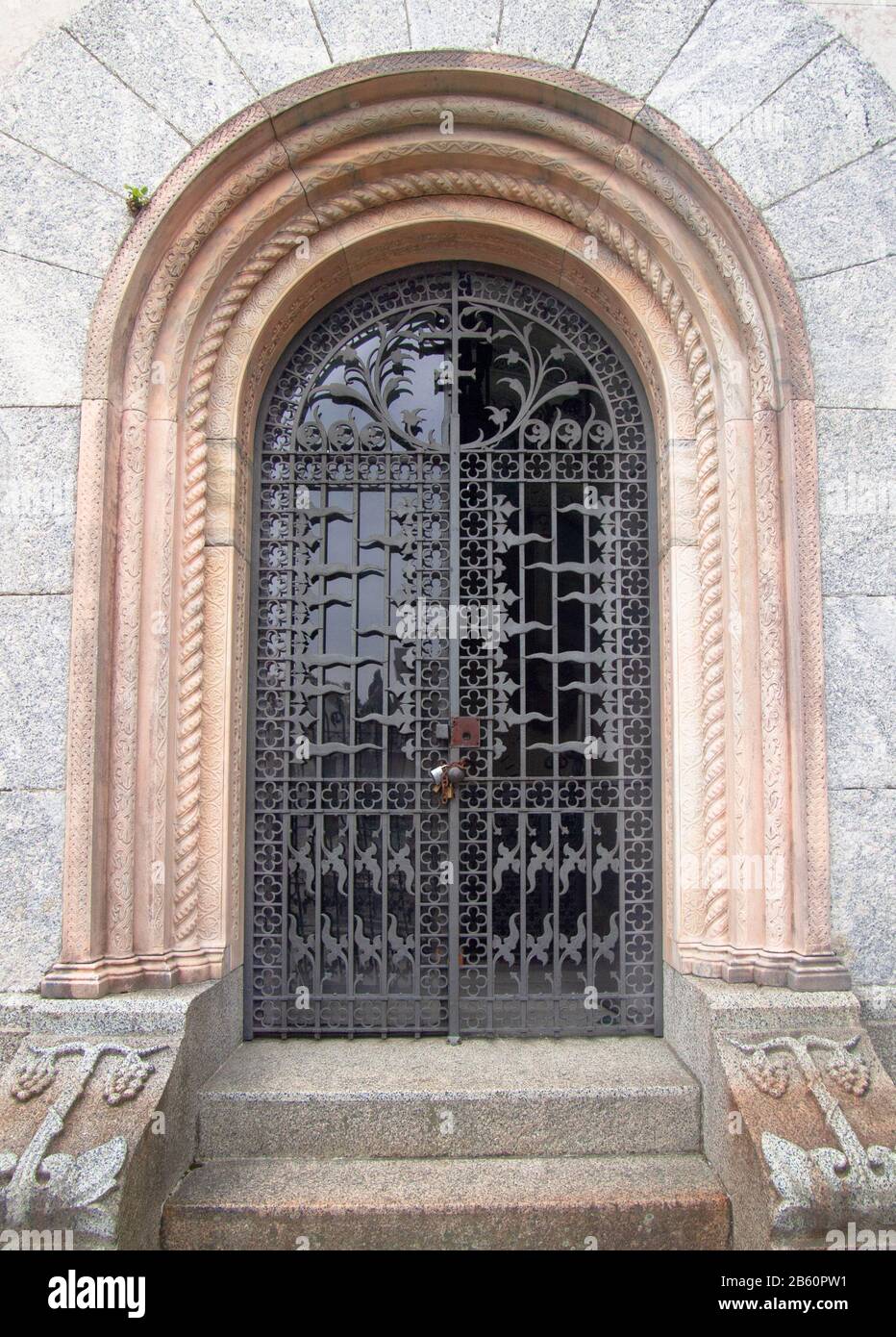 Arched Door In Wrought Iron With Floral Decorations And Alabaster Frame Stock Photo Alamy
