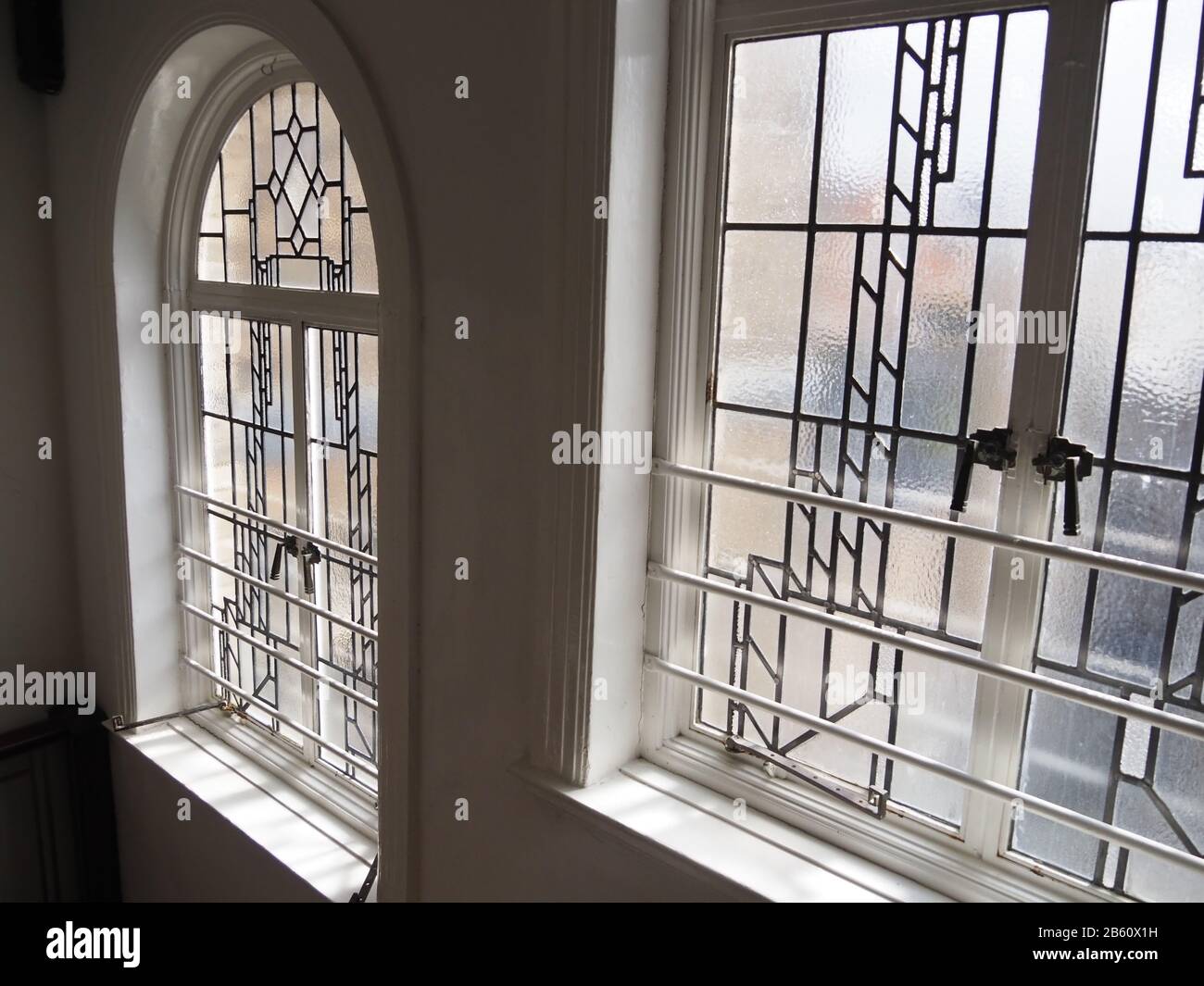 art deco window details with geometric leadwork and frosted glass Stock Photo