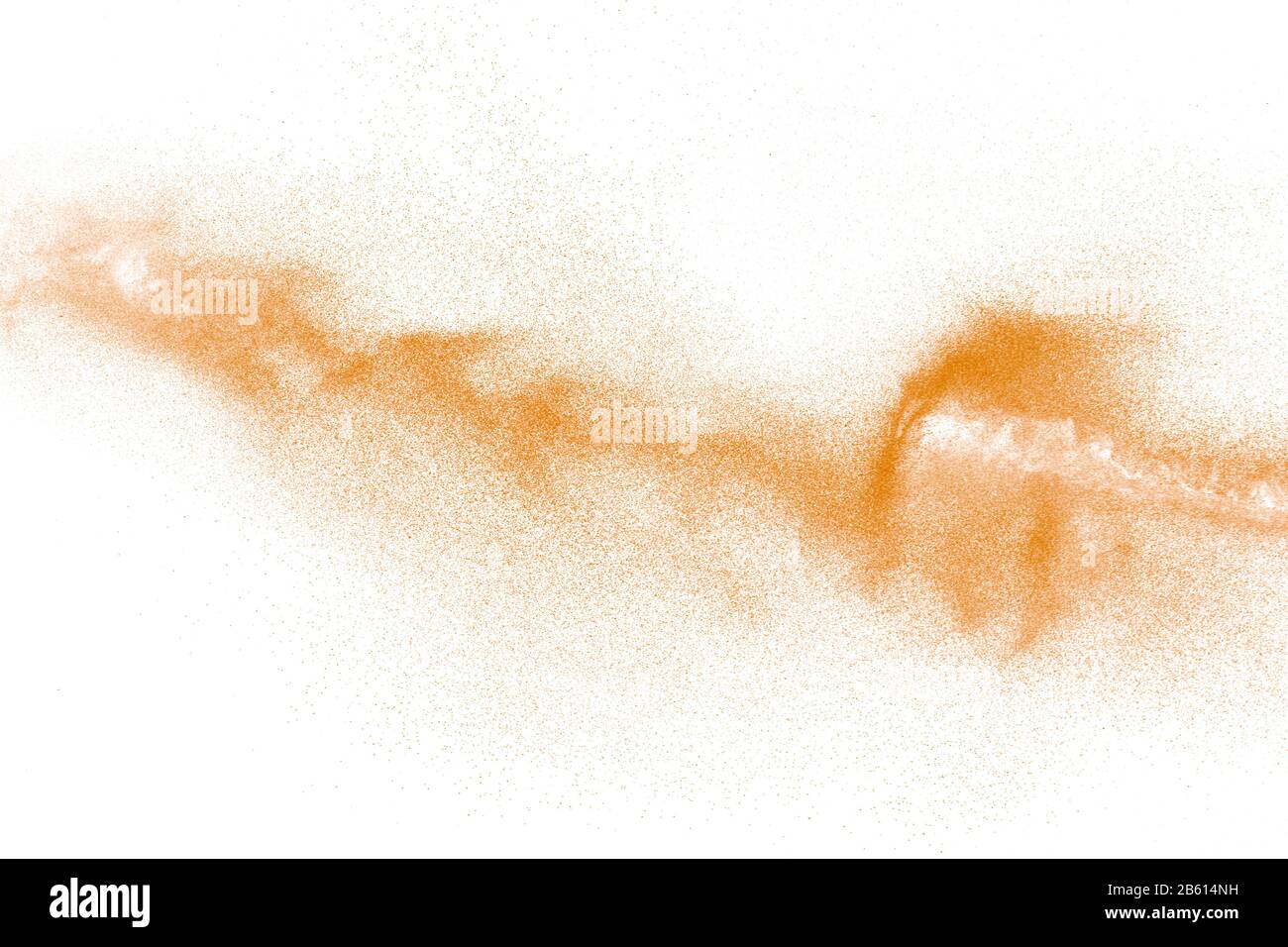 Orange powder dust particles explosion on white background.Orange dust