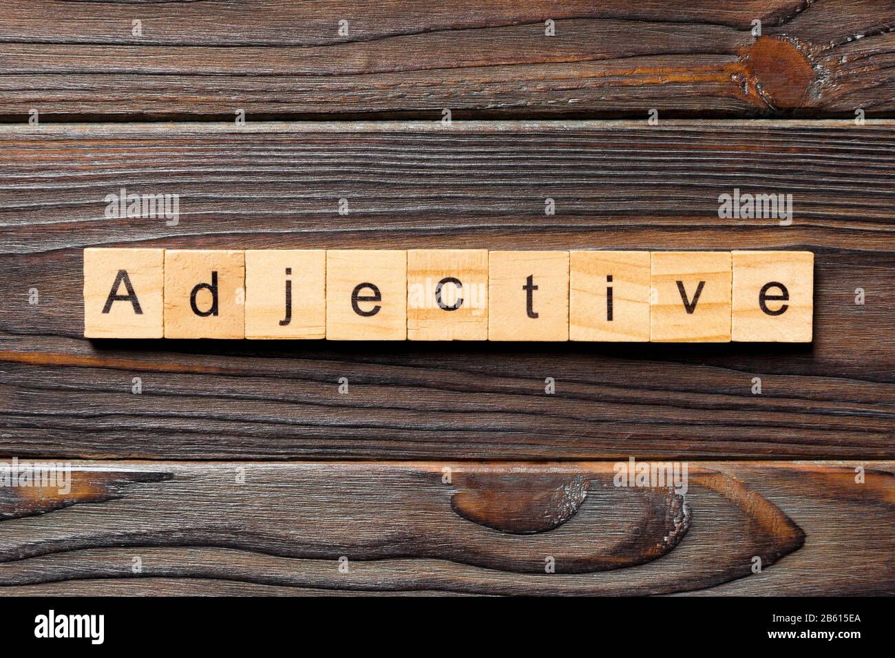 adjective word written on wood block. adjective text on wooden table for your desing, concept. Stock Photo