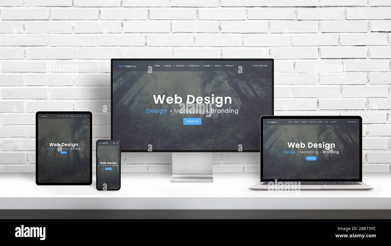 Web design agency concept presentation on displays of different dimensions. Modern flat web design template, theme concept. White brick wall in backgr Stock Photo