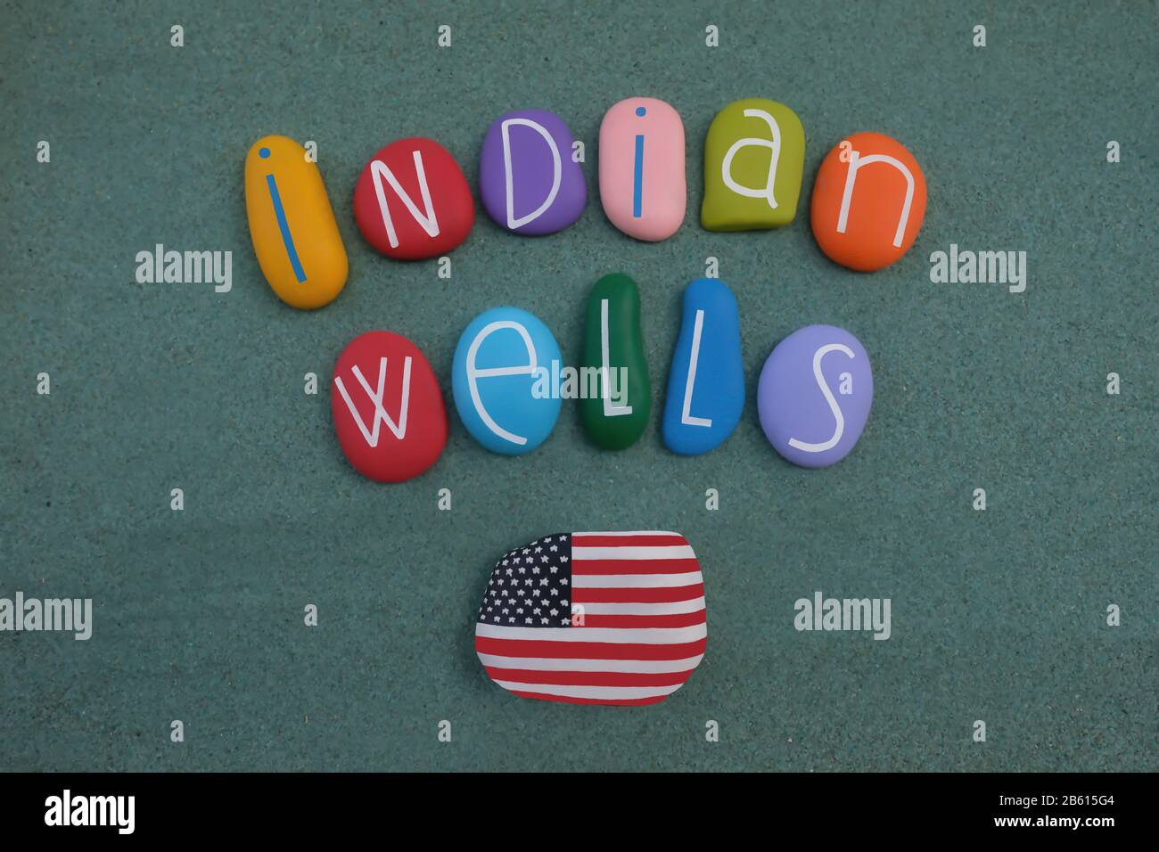 Indian Wells, city in Riverside County, California, in the Coachella Valley, USA, souvenir with colored stone letters and USA flag painted on a rock Stock Photo