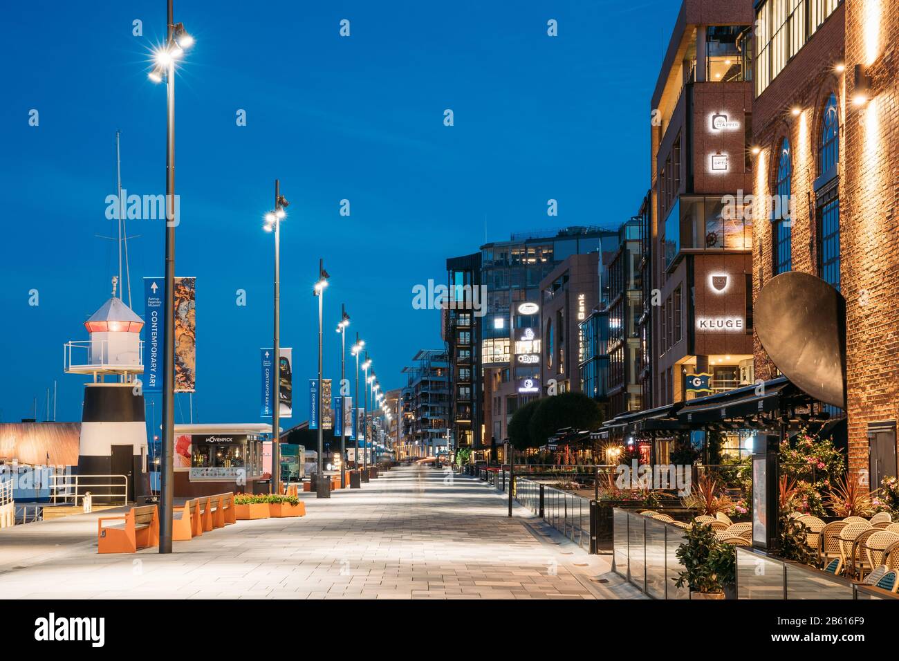 Oslo, Norway - June 24, 2019: Night View Embankment And Residential Multi-storey Houses In Aker Brygge District. Summer Evening. Residential Area Refl Stock Photo