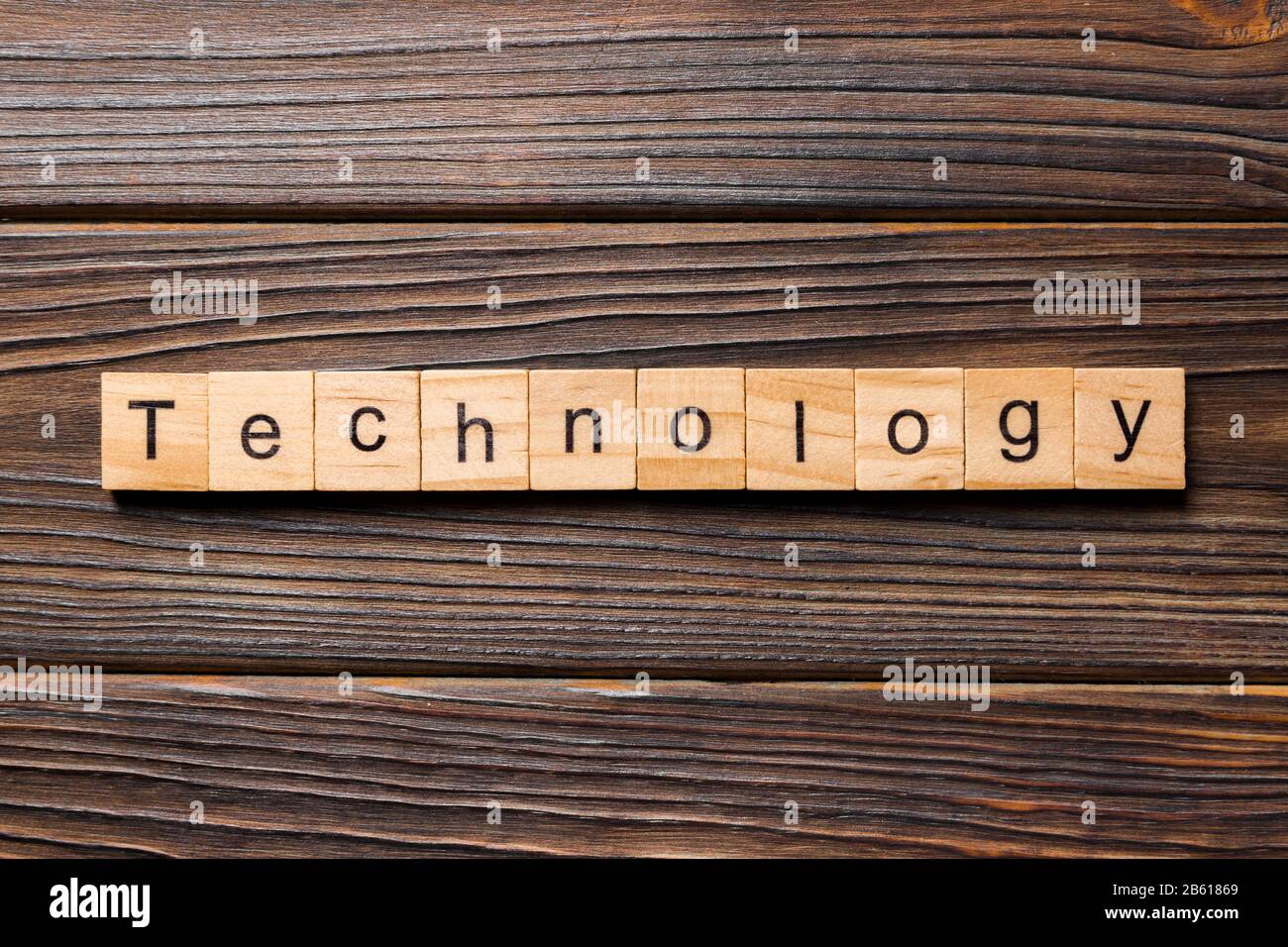 Technology word written on wood block. Technology text on table ...