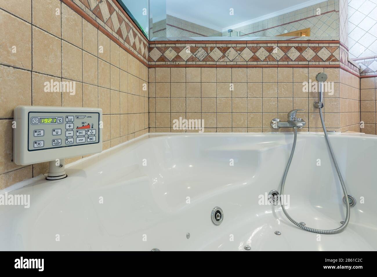 Luxury Jacuzzi bath. With the control panel Stock Photo Alamy