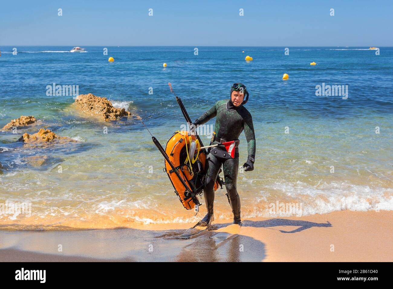 Underwater hunter in flippers preparing to dive. Underwater fishing in