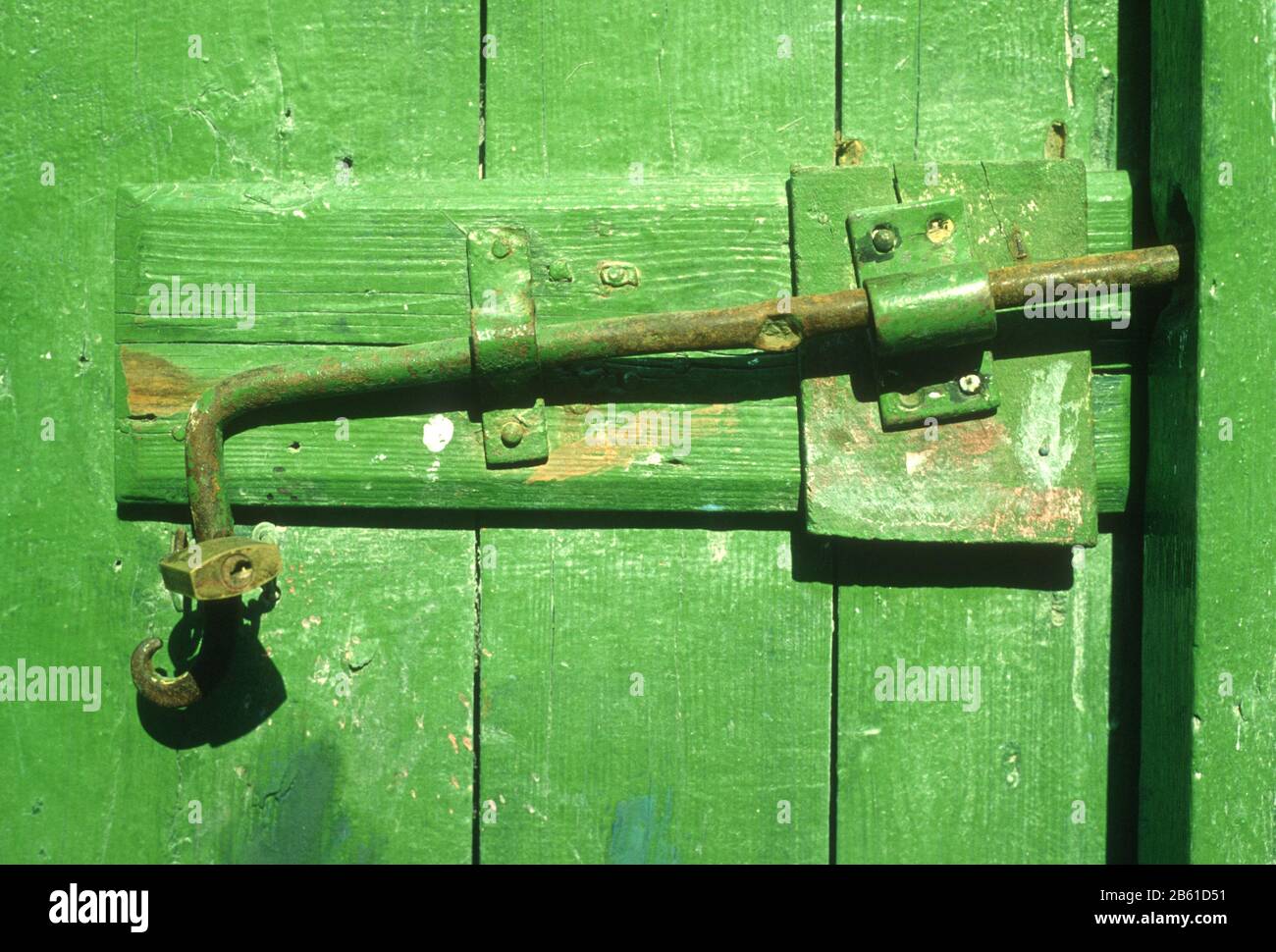 Hand made fittings on an old wooden, painted, green door in Metsovo, Ioannina, Epirus, Greece Stock Photo