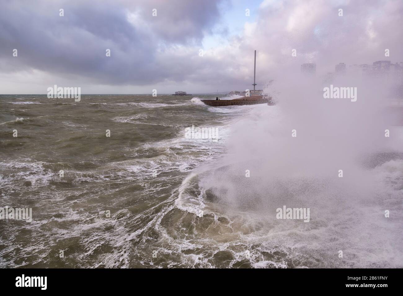 waves and a storm blowing into Brighton Stock Photo