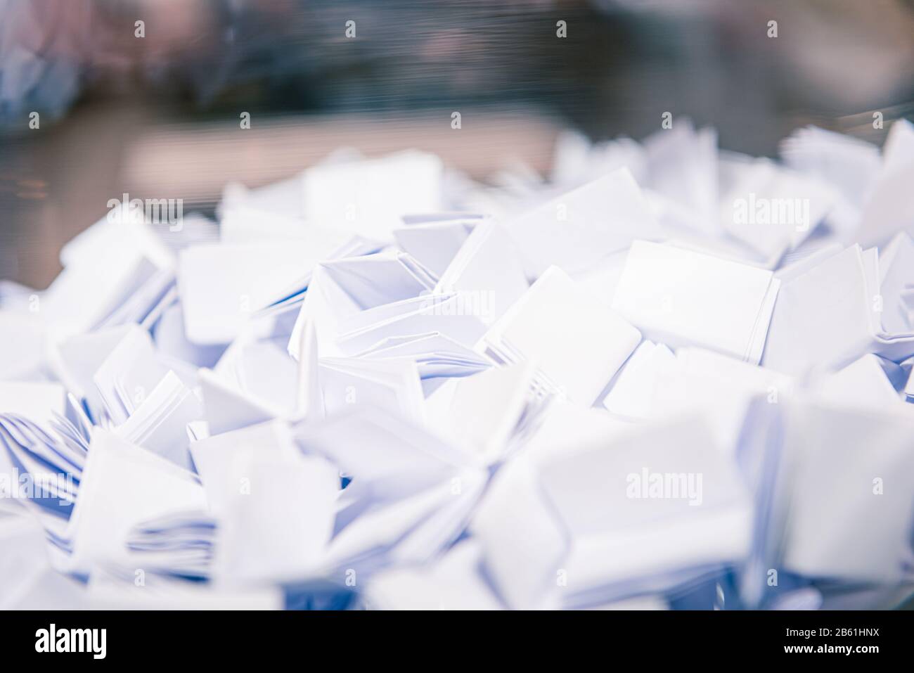 who will be the lucky winner, many raffle tickets in a bowl, ready for the lucky person Stock Photo