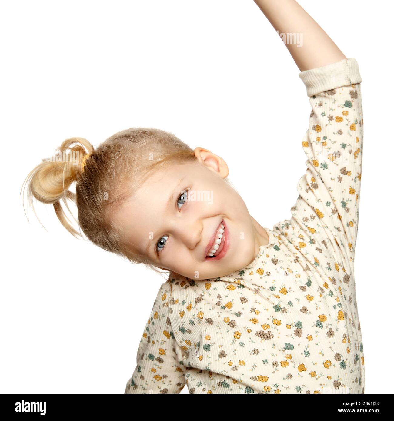 Portrait of smiling little girl, isolated over white background with ...