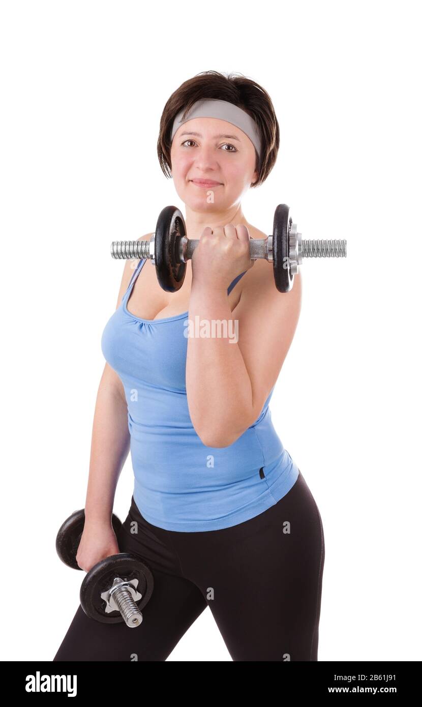 Woman engaged in fitness with dumbbells. Close up on white background. Stock Photo