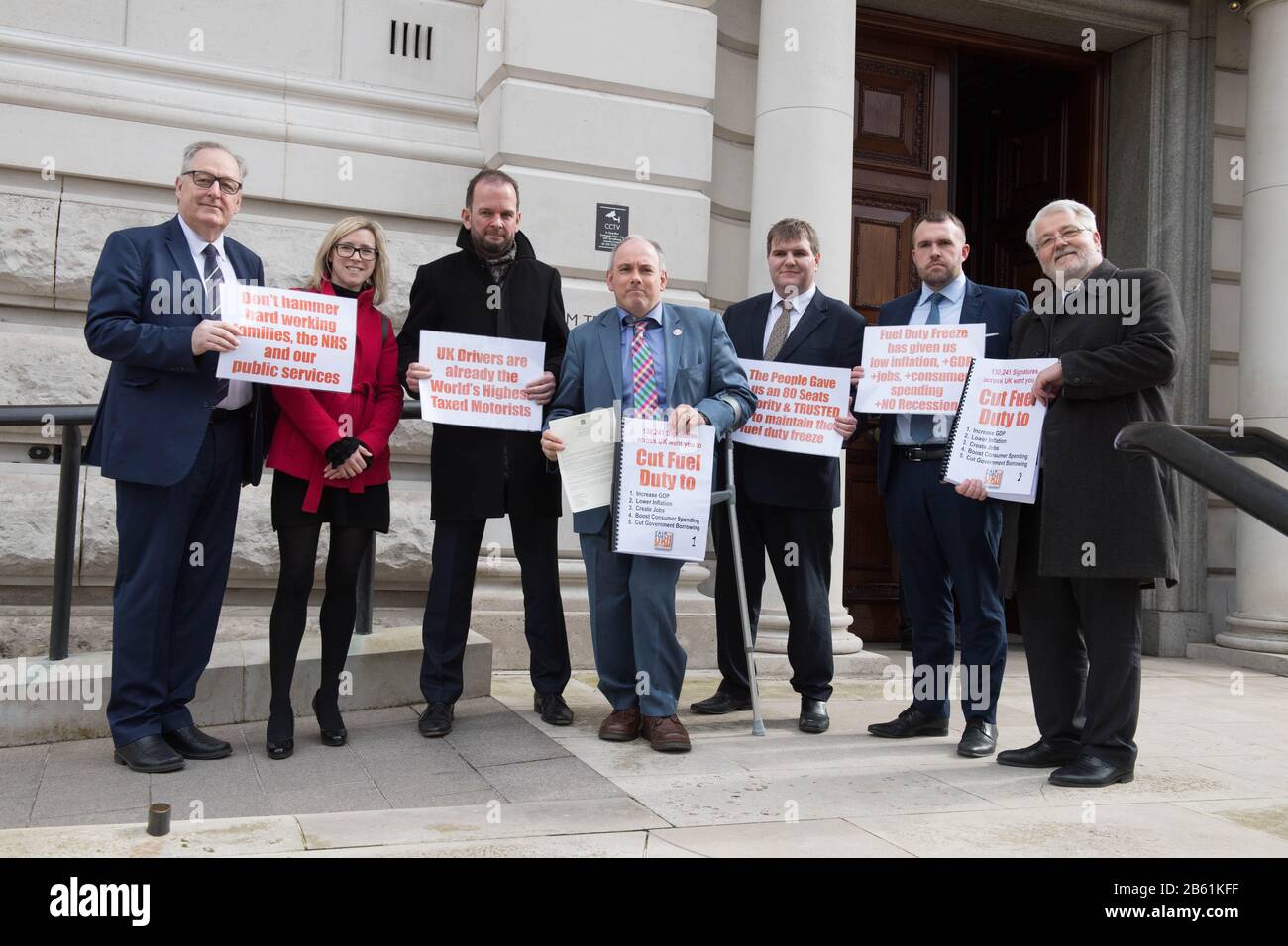 (left to right) Howard Cox and Heidi skinner of the Freight Transport Association, James Daly MP, Robert Halfon MP, Jamie Wallis MP Jonathan Gullis MP and Duncan Buchanan of the Road Haulage Association outside The Treasury in Westminster, London, preparing to hand in a letter to Chancellor of the Exchequer Rishi Sunak urging him not to 'balance environmentalism on the backs of working people'. Stock Photo