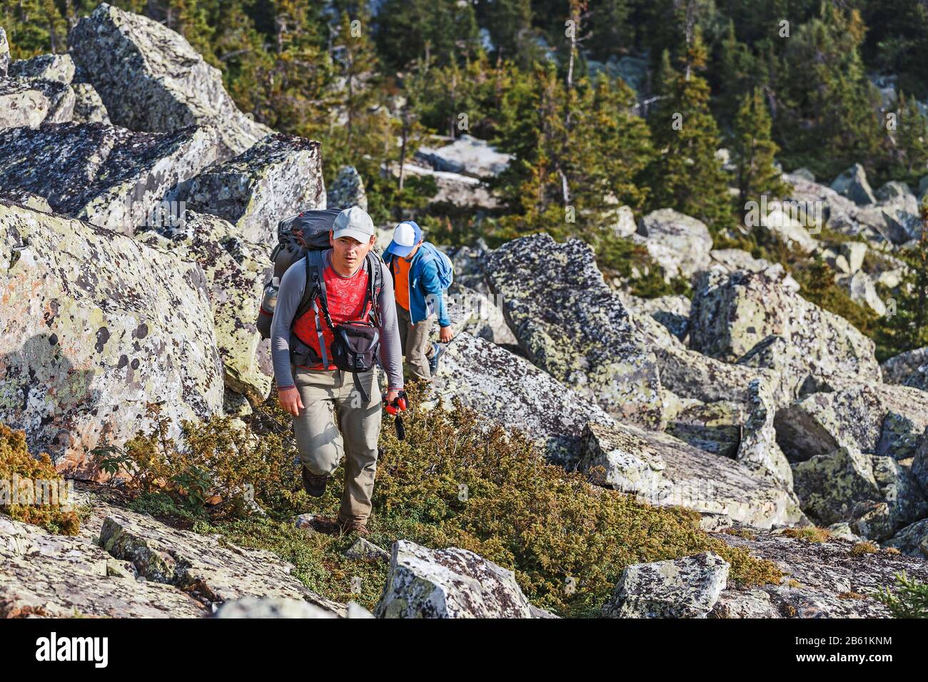 Father and son walking in the mountains Stock Photo