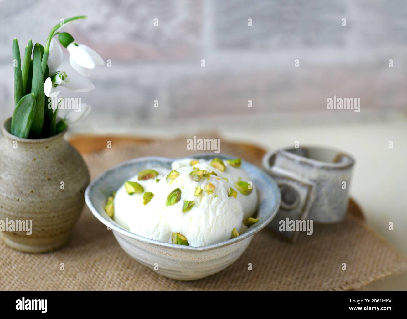 white ice cream with pistachio  food background shot with copy space and room for text Stock Photo