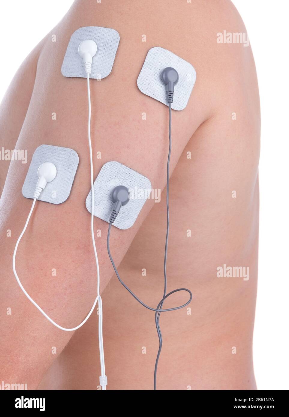 Electrostimulator of massager on shoulder biceps. For procedures and relaxation. Stock Photo