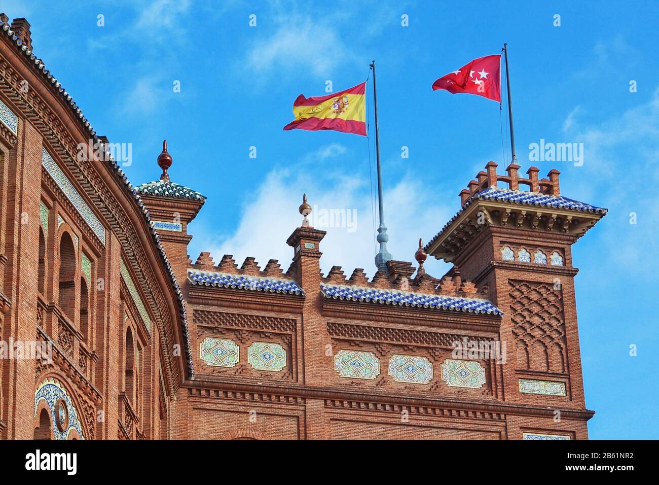 National flags of Spain in Madrid on Pras bullring bulls. Against the blue sky. Stock Photo