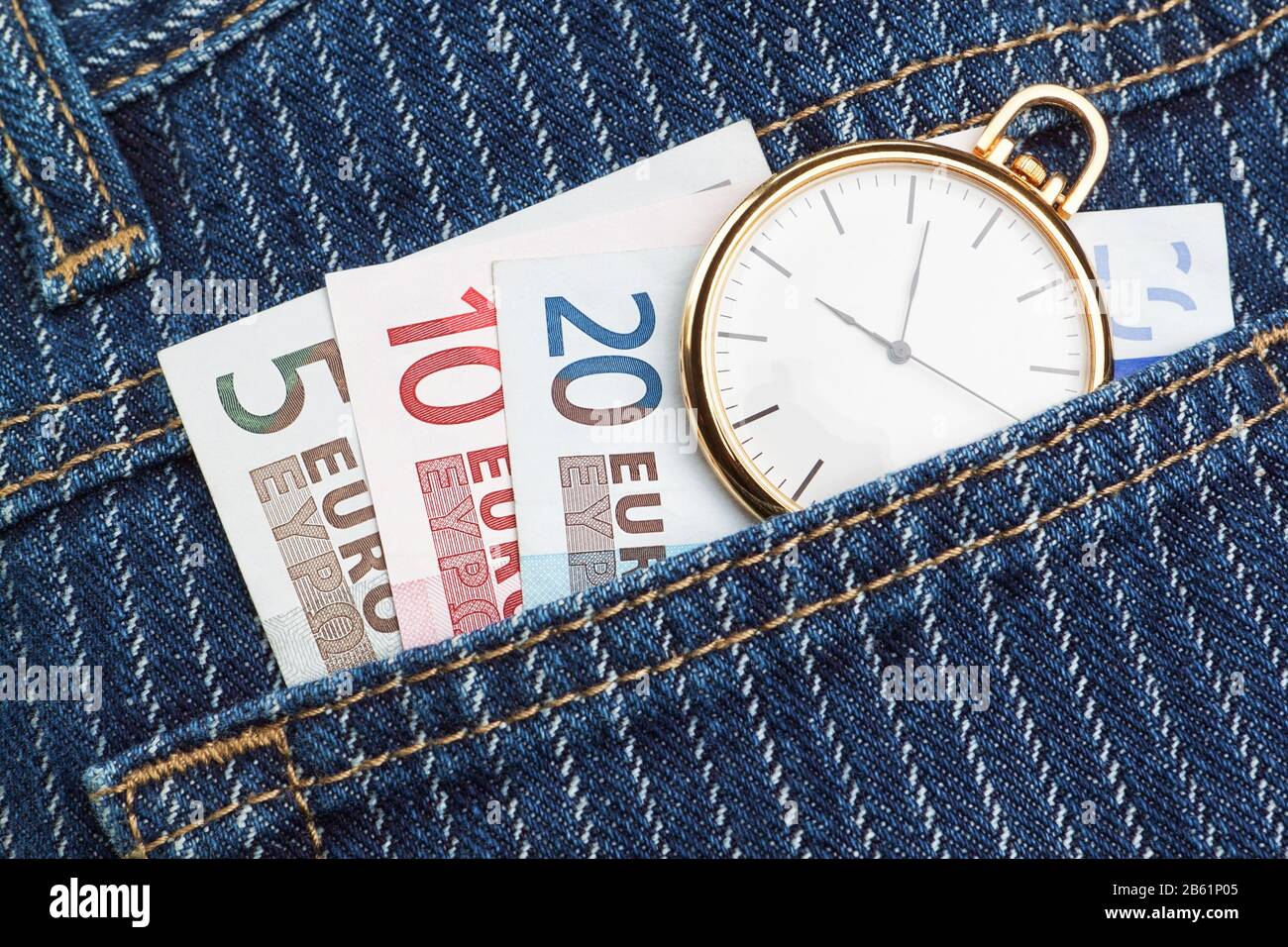 Pocket watch in your pants and jeans with money euro. Closeup Stock Photo -  Alamy