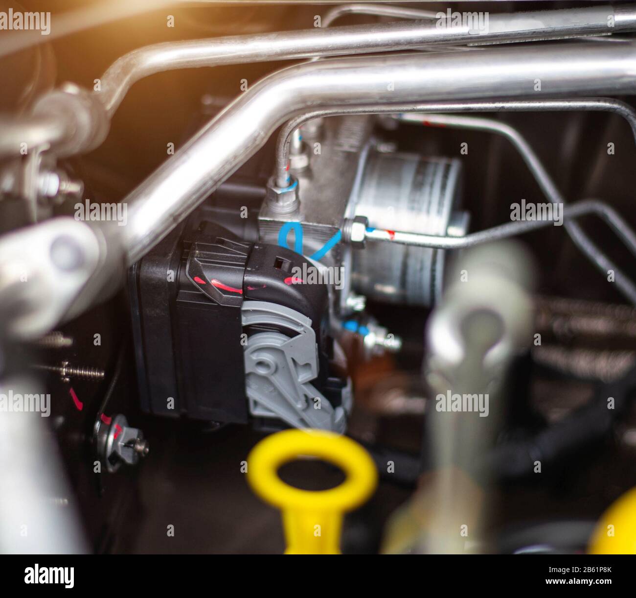 Car air conditioning with freon in the engine compartment, background