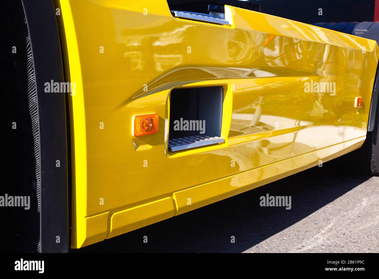 A beautiful wing made of plastic on a truck for the best aerodynamics of the car. Step for the cabin entrance, background Stock Photo