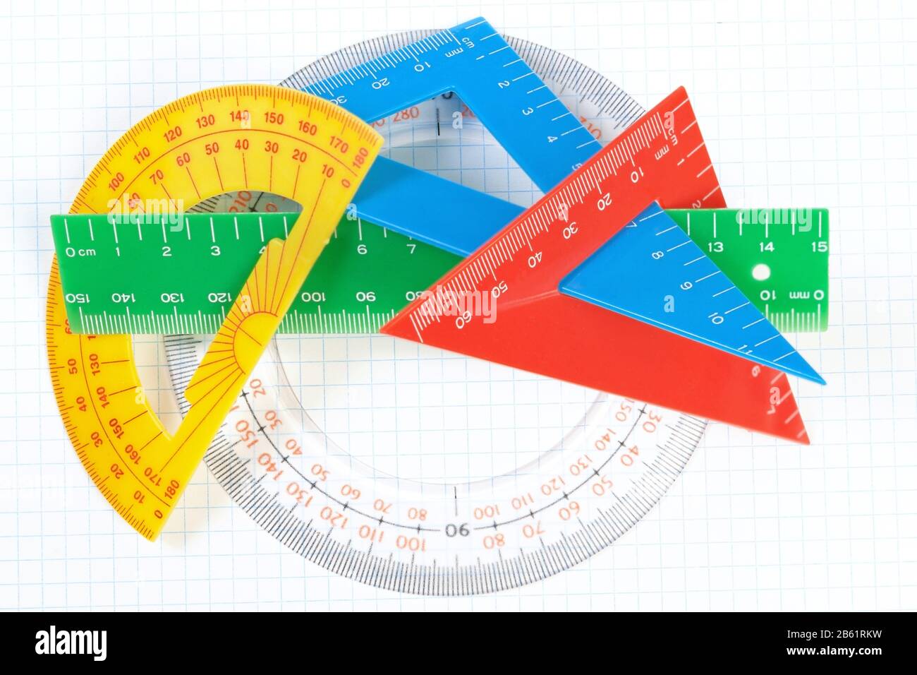 A set of colored triangles and lines protractors for drawing. On a
