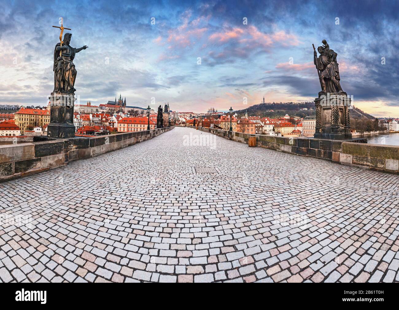 Panorama Of Empty Charles Bridge In Prague With Statues And Towers At panorama-of-empty-charles-bridge-in-prague-with-statues-and-towers-at