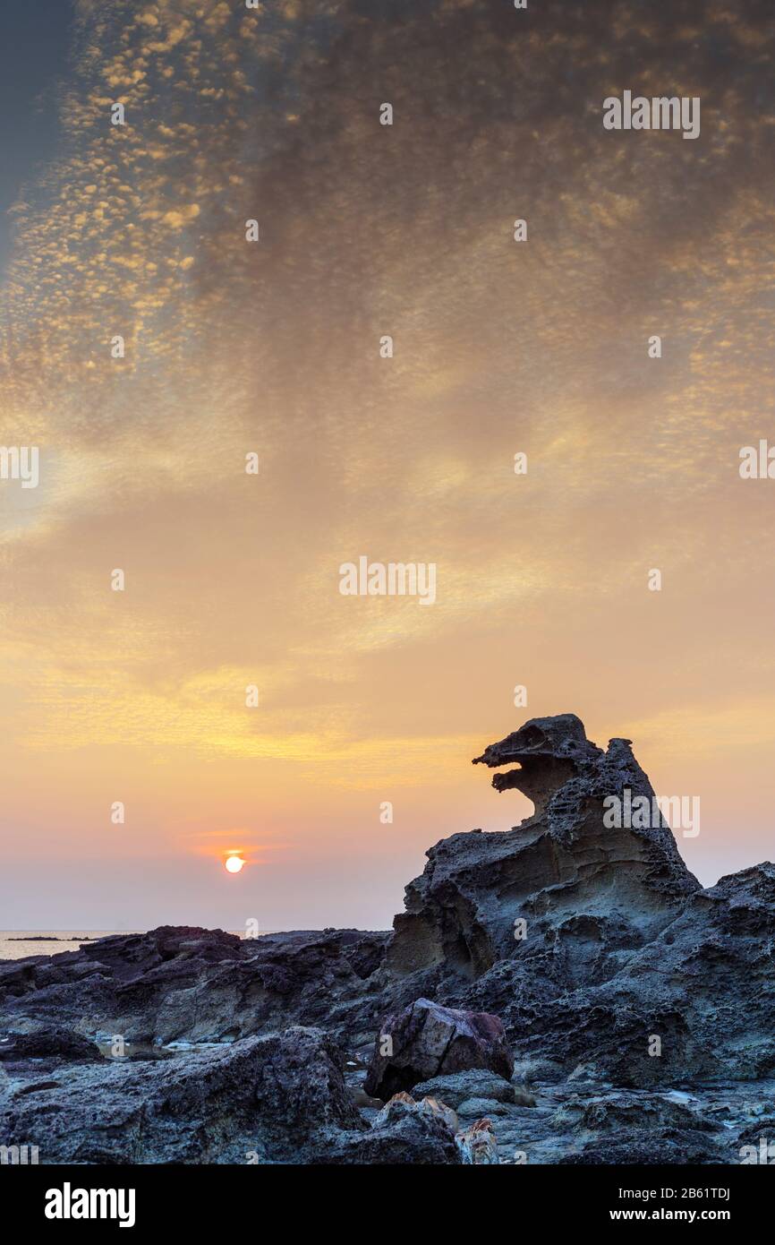 Japan, Honshu, Tohoku, Akita prefecture, Godzilla rock at sunset Stock Photo