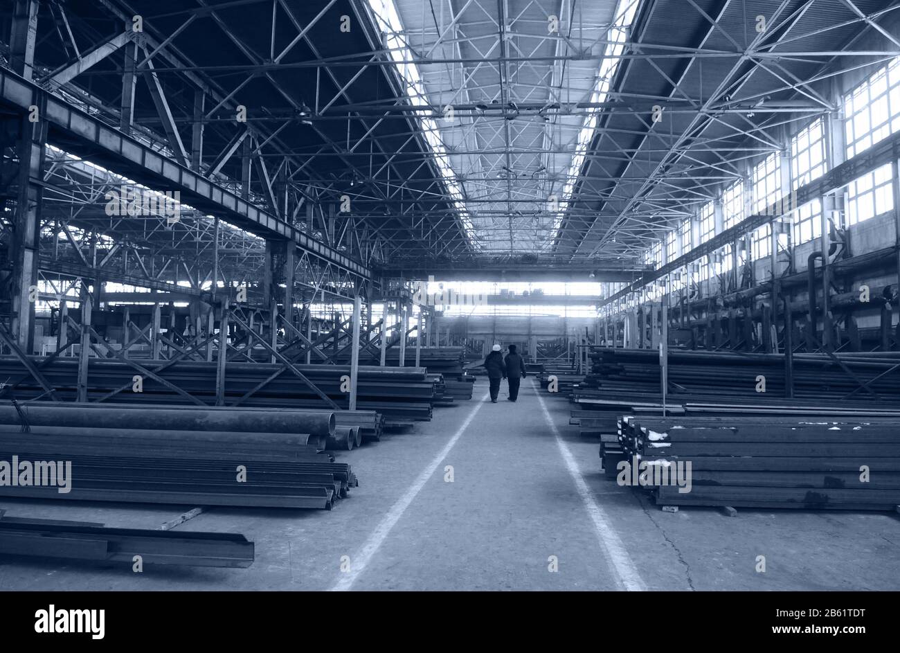 Rambling shop floor has been built as steel construction. This production department make a specialty out of metalworks manufacturing. Stock Photo