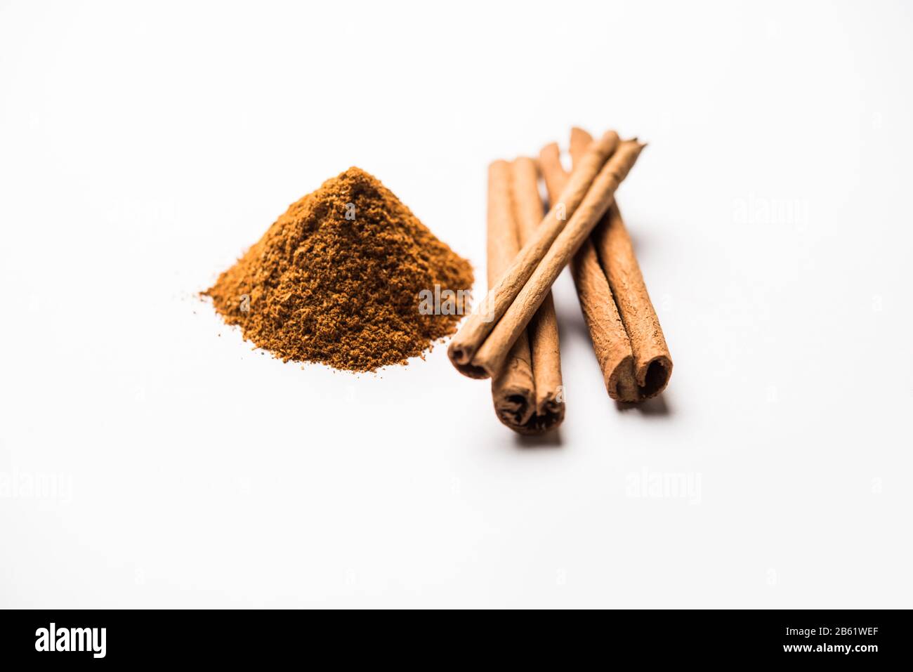 Powder cinnamon and sticks also known as Dalchini or Dalcheenee masala from India, selective focus Stock Photo
