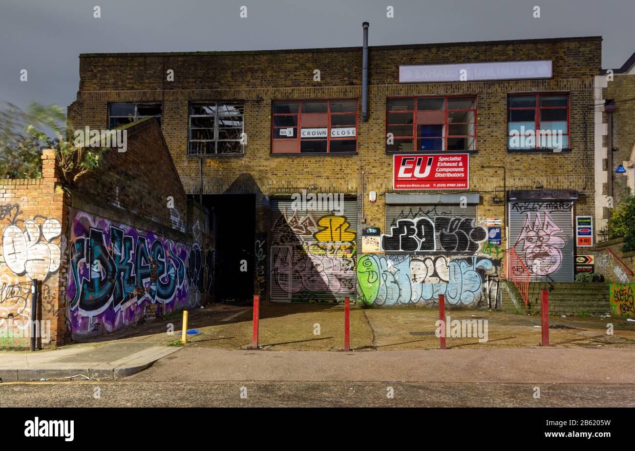 London, England, UK - January 2, 2020: Light industrial buildings stand derelict and abandoned during regeneration of the Fish Island neighbourhood of Stock Photo