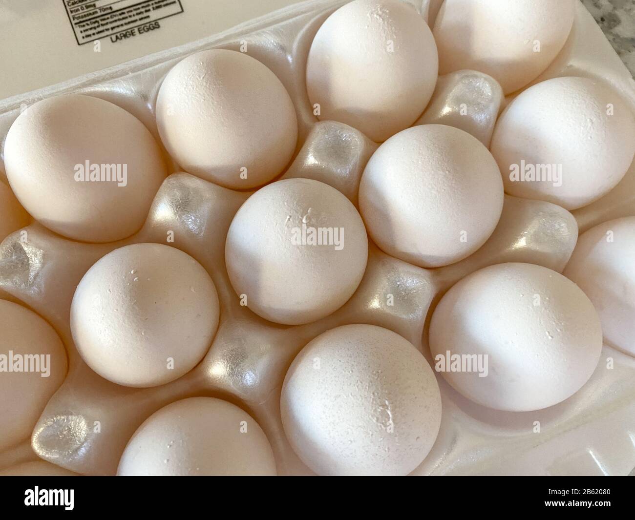 Fresh white eggs in an egg carton Stock Photo - Alamy