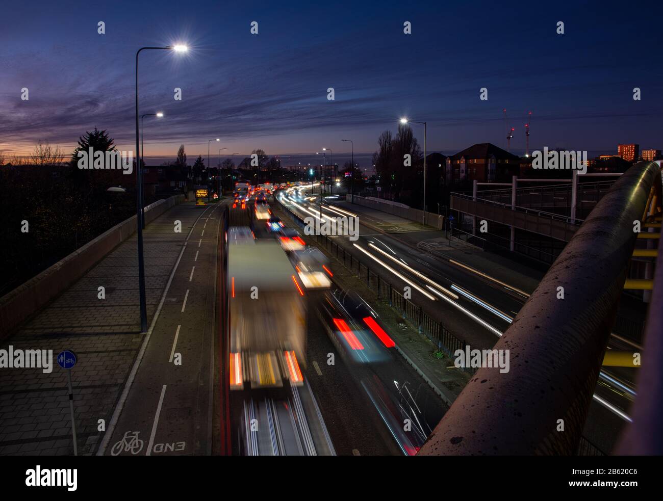 London, England, UK - December 3, 2019: Traffic flows along the A40 Western Avenue Road at night in West London. Stock Photo