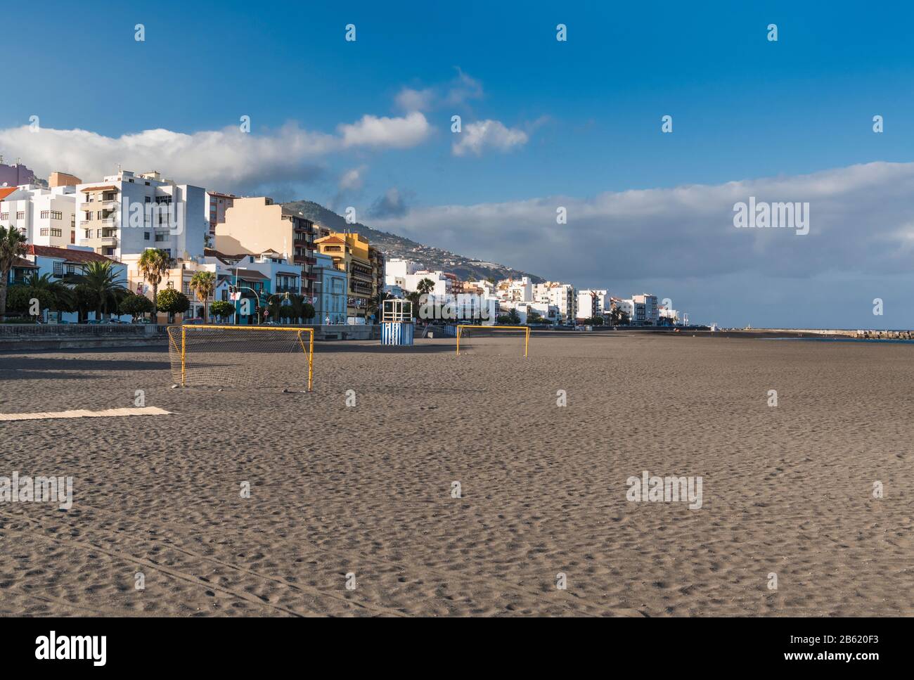 The sandy beach on the seafront in Santa Cruz de La Palma with goalposts for beach football, almost deserted on a summer's evening Stock Photo
