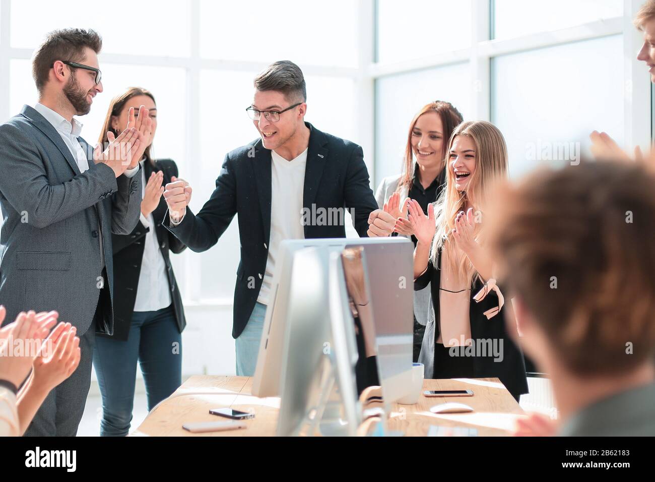 Excited young businessman clapping cheering hi-res stock photography ...